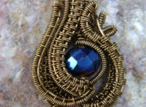 Antique Bronze Wire-Wrapped Pendant – Multicolored Faceted Glass Bead