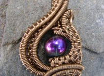 Antique Bronze Wire-Wrapped Pendant – Iridescent Multicolored Glass Bead